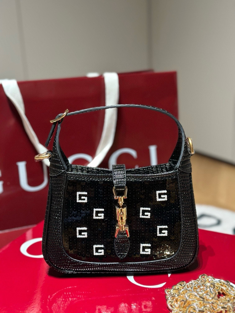 G*u*i top handle bags